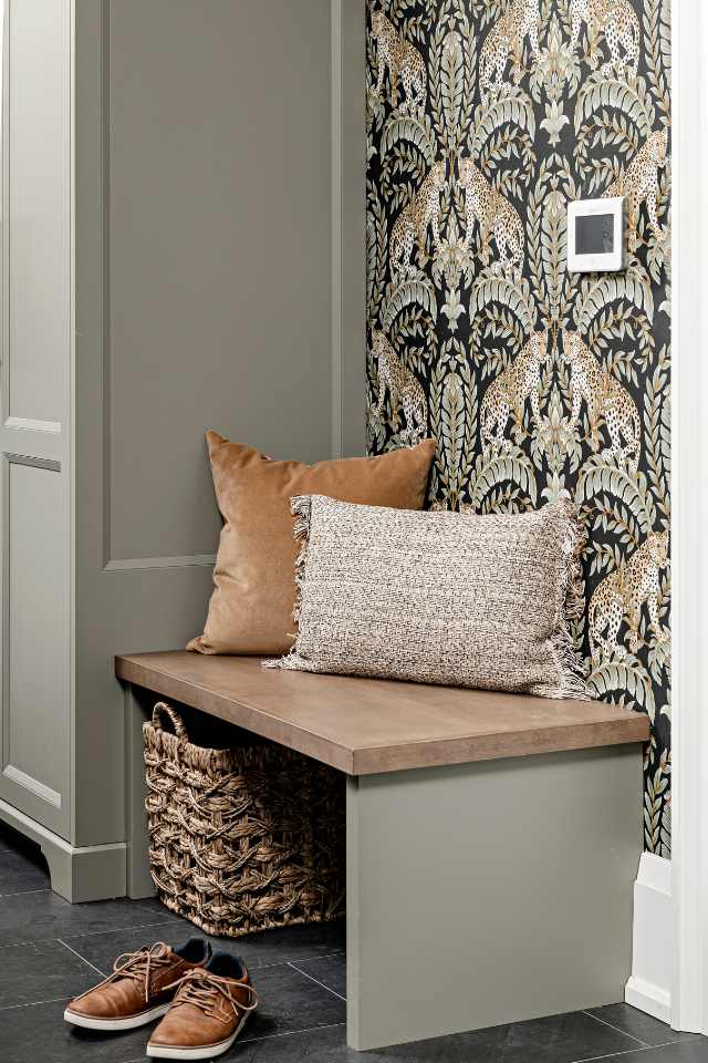 designer entryway way with tile floors and jewel toned wallpaper